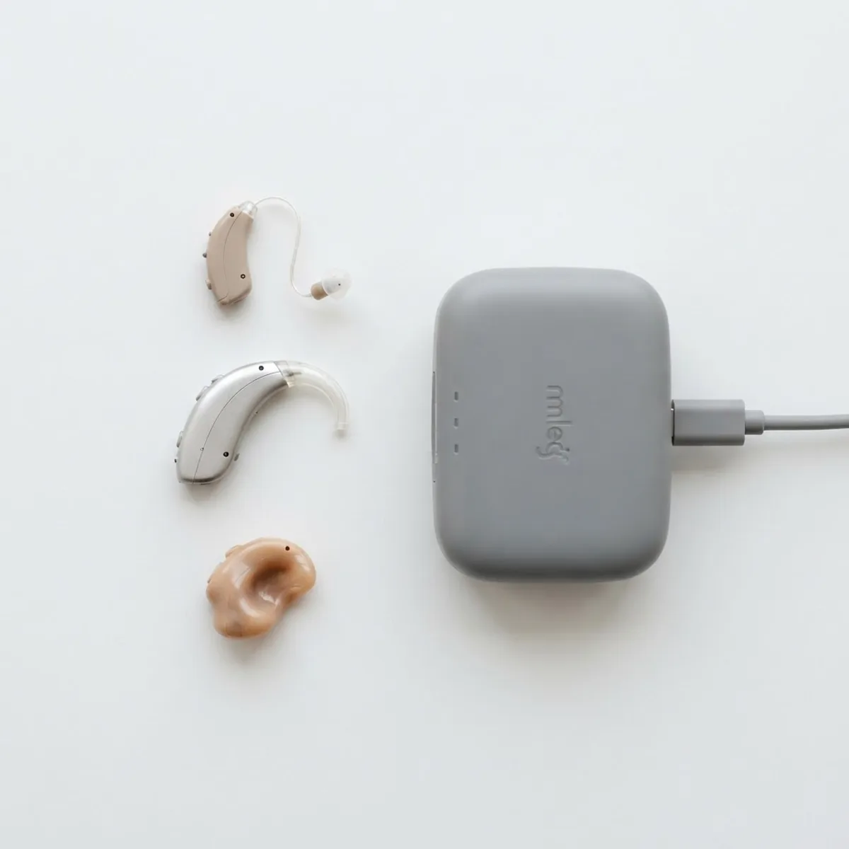 Three modern AI hearing aid styles with a charging case